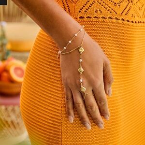 Golden sea shell hand charm